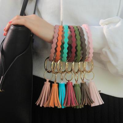 China 2022 Wholesale Silicone Wristband Silicone Key Chain Wear Around Key Chain Wrist Strap Diamond Silicone Bangle Keychain Geometric Tassel for sale