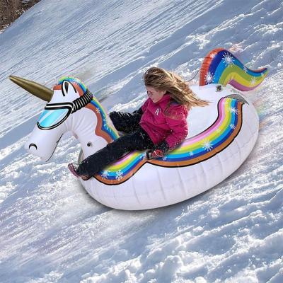 China Winter Toy Inflatable Unicorn Snow PVC Tubes For Kids Adults Snowboard With Handle for sale