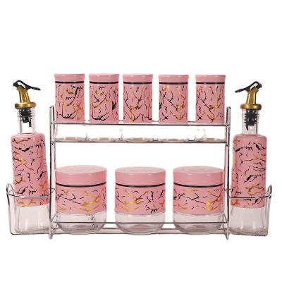 China 2022 Freshness Preservation New Kitchen Storage Set 10 Piece Glass Jar Set Pink Textured Stone Spice Jar Storage Jar Oil Jar for sale