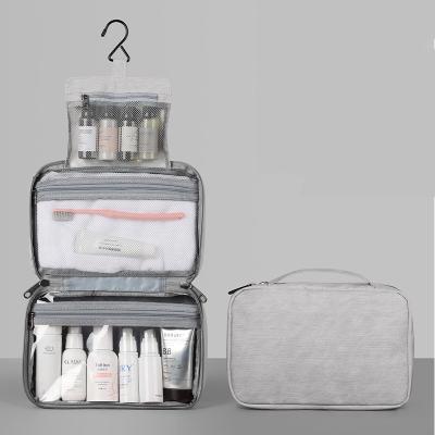 China Fashion OEM Luxury Travel Train Hook Makeup Organizer Bag Portable Waterproof Hanging PU Toiletry Storage Cosmetic Bag for sale