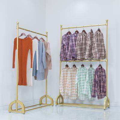 China Metal Double Bar Industrial Gold Metal Clothing Wall Display Rack Metal Clothing Rack For Shop for sale