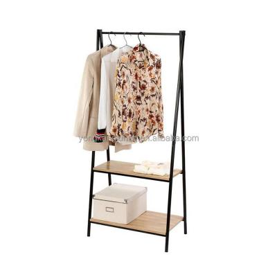 China Modern Freestanding Clothing Rack Easy Assemble Garment Rack Sturdy Standing Metal Clothing Rack with 2 Wooden Shelves for sale