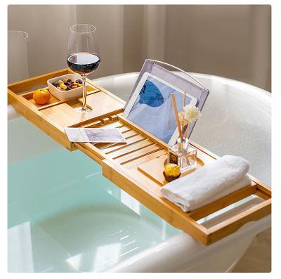 China Hot Sale Luxury Wooden Stocked Bathtub Caddy Bamboo Bath Tub Tray with Expanding Sides Shower Organizer for sale