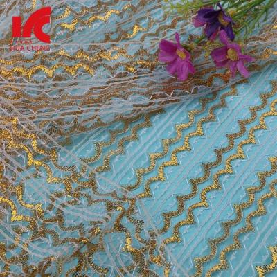 China Viable wholesale polyester gold border lace trim, high quality gold lace fabric for sale