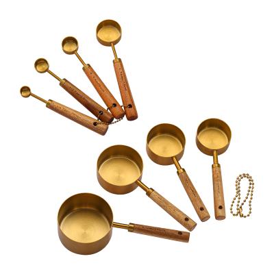 China Sustainable Premium Custom Stainless Steel Gold Finished 8pcs Measuring Cups And Spoons With Wooden Handle for sale