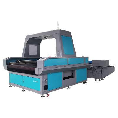 China Water Cooled Auto Feeding Dual Head Large Vision Asynchronous CCD Camera 1610/1810 CO2 Laser Cutter For Digital Printed Roll Fabric Textile for sale