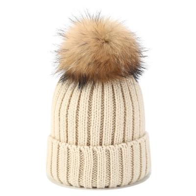 China COMMON beige solid color warm winter pom pom outdoor unisex adult beanie knit hat for sale