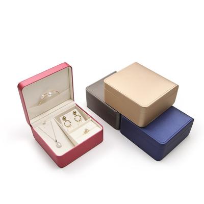 China Fashion drawer box bottom one ring bracelet earring jewelry packaging box hanging jewelry box set in high quality PU leather classic packaging cover with logo made on demand for sale