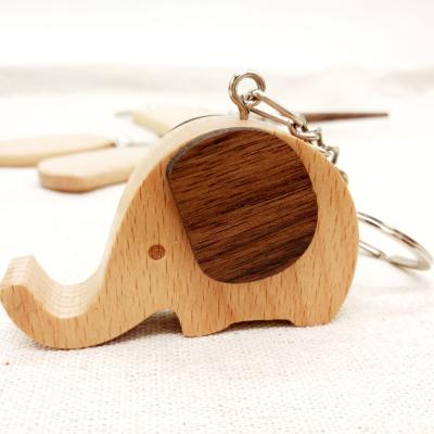 China Eco-friendly multi-functional wooden key chain that can be used as a cell phone holder for sale