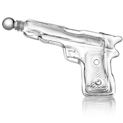 China Wholesale Gun Shaped Liquor Decanter Factory Illustration Glass Bottle With Cork for sale