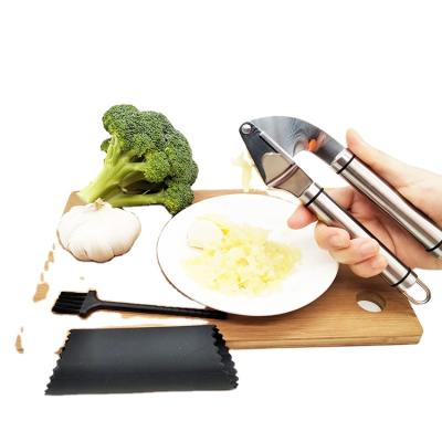 China Amazon Kitchen Tools Sustainable Premium Stainless Steel Garlic Press With Black Silicone Peeler And Brush for sale