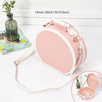 China Curved Carry Case 13inch Vintage (Embossed Pink) Carry On Small Suitcase PU Leather Train Case With Metal Snap For Women for sale