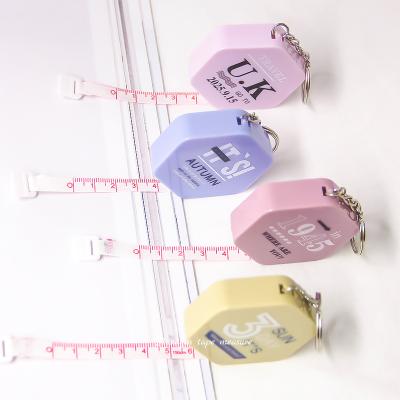 China 1.5 Meter/60-inch Portable Mini Hexagon Shape Plastic Material Retractable Ruler Tape Measure With Key Chain for sale