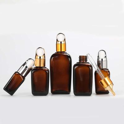 China 10g 20g 30g 1oz Cosmetic Amber Square Frosted Black Lotion Dropper Glass Bottle Essential Oil Bottle for sale