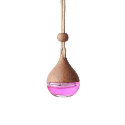 China Cosmetic Empty Glass Freshener Car Perfume Hanging Diffuser Bottle 5ml With Wooden Lid for sale