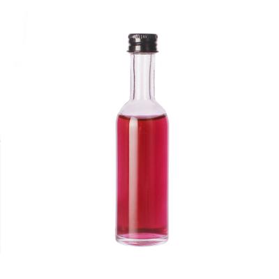 China Wholesale 50ml Glass Beverage Wine Bottle Vodka Bottle Small Round Transparent Glass Bottle for sale