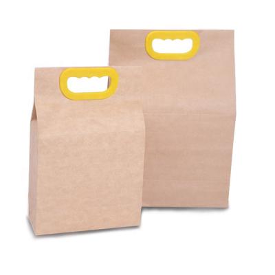 China Custom Logo Reusable Wholesale Price Packaging Bag Waterproof Size 1KG 2KG 5KG Recyclable Heavy Duty Tea Gift Rice Paper Packaging Bag With Hand Hole for sale