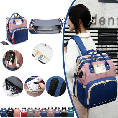 China With USB Diaper Bag Backpack With Backpack Multifunctional Maternity Baby Hutch Travel Changing Bags With Foldable Crib for sale