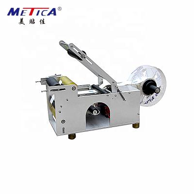 China Semi-automatic round bottle food plastic self-adhesive labeling machine and manual label applicator for sale