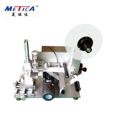 China Food low price sticker semi automatic adhesive bottle labeling machine and flat and top outdoor labeling machine for sale