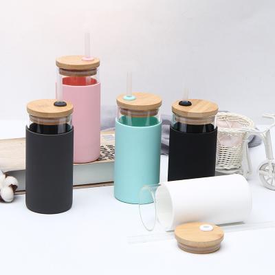 China Viable Custom Logo 16oz Silicone Water Sleeve Bamboo Glass Cup Lid Glass Tumbler With Bamboo Straw for sale