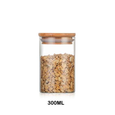 China Freshness Preservation Manufacturers Wholesale Kitchen Storage Glass Jars With Bamboo Wooden Lids for sale