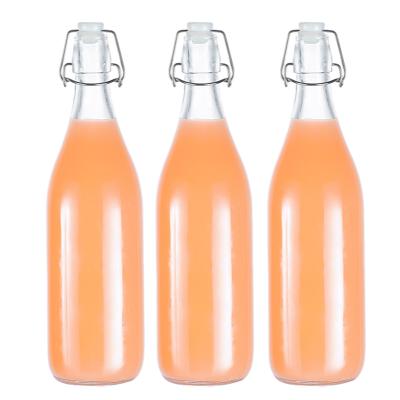 China Freshness Preservation New Product Hot Selling1000ml Round Clear Transparent Glass Beverage Bottles With Caps for sale