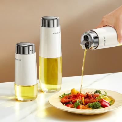 China 280ml 500ml Kitchen Glass Auto Flip Oil Dispenser Cooking Leakproof No Drip Stainless Steel Cap Oil Container Soy Sauce Bottle for sale