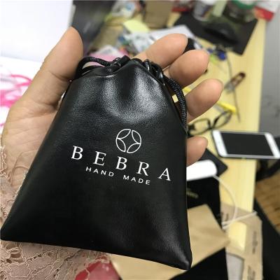 China Recyclable Custom Printed PU Leather Wristband Drawstring Pouch Small Size Bag for sale