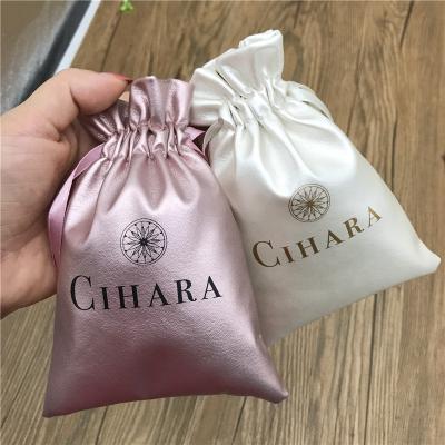 China Small recyclable leather jewelry pouch with embossed logo for sale