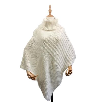 China Winter Designer European American Poncho Shawl Wrap Knitting With Tassel Cable And Scarf Warm Ponchos For Women for sale