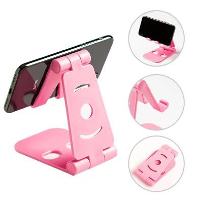 China Popular creative desktop phone stand for iPhone 12 max double folding pro portable stand for lazy people for sale