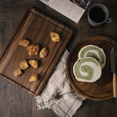 China Sustainable Solid Wooden Bread Board Black Walnut Cutting Cutting Western Dinner Dish Walnut Cutting Board for sale