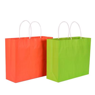 China Wholesale Disposable Kraft Paper Gift Bag With Handle And Logo Print for sale