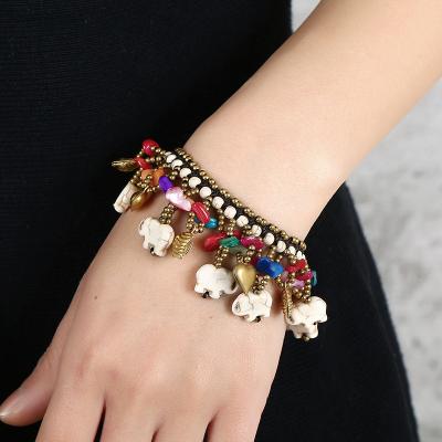 China FASHIONABLE Bohemian Wax Handmade Thread Bracelet Colorful Elephant Copper Stone Pine Weave Beaded Bracelet for sale