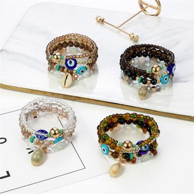 China Handmade Bohemian Multi String Shell Big Eye Pendant BOHEMIA Shell Bracelet Artifical Crystal Stone for sale