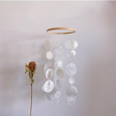 China Shell Handmade Capiz Shell Wind Chime Hanging Open Shell Beach Wedding Decor Home Natural Decor for sale