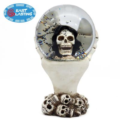 China Head Europe 120mm Halloween Skull Resin Christmas Snow Globe, Water Globe Souvenir With Black Blowing Snow for sale