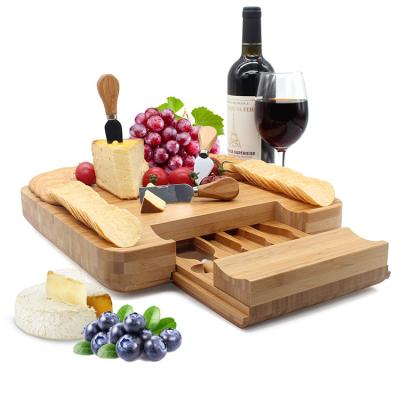 China New Sustainable Eco Friendly Natural Bamboo Cheese Serviang Board Party Use Cheese Cutting Board for sale