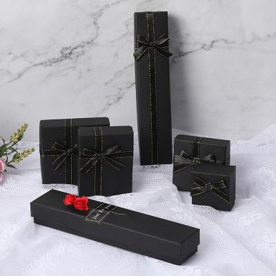 China Recyclable Elegant Girl's White Stain Bowknot Earrings Necklace Packaging Box Custom Printed Logo Black Jewelry Box for sale