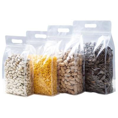 China Moisture Proof PVC Clear Bottom Self Supporting Ziplock Packaging Bag With Handles For Dried Fruits for sale