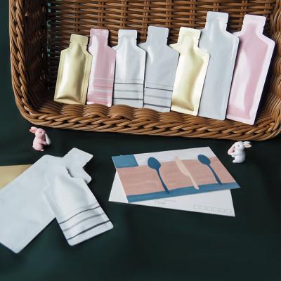 China Moisture Proof Unique Shaped Aluminum Foil Laminated Plastic Heat Sealable Small Cosmetic Packaging Sample Sachet Bags for sale