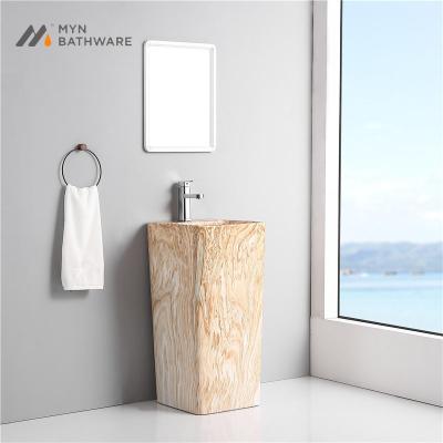 China Unique hot sale design color fashion square shape ceramic calcatta ceramic ware freestanding marble washbasin for sale