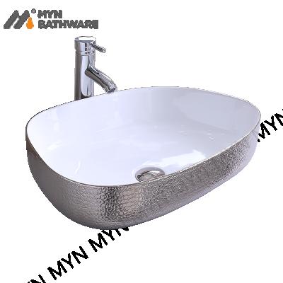 China Unique Modern Art Design Basin New Design Ceramic Hand Wash Table Top Gold Basin for sale