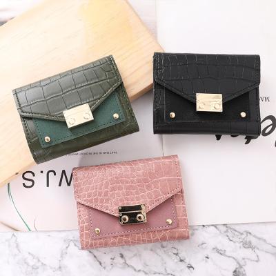 China New trend waterproof short female buckle small wallet crocodile pattern coin purse bitcoin wallets for sale