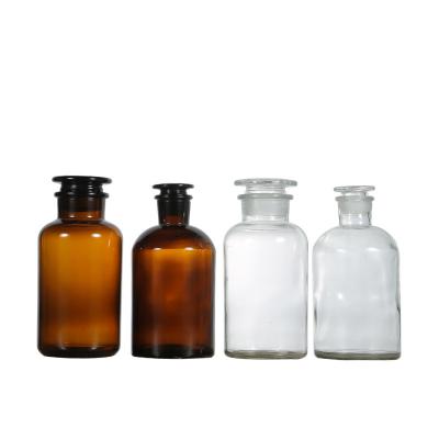 China Fashion 60ml 125ml 250ml 500ml 1000ml Wholesale Empty Amber Wide Mouth Apothecary Lab Glass Reagent Bottles With Cork Glass Stopper for sale