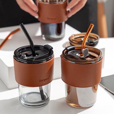 China New Viable Wholesale Luxury Customize Logo Transparent Glass Thermal Insulation Layer Coffee Mug Water Leather Cup With Lid And Straw for sale