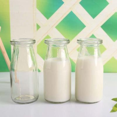 China Wild Mouth 750mL 500mL 400mL 375mL 250mL 200mL Beverage Clear Glass Milk Bottles With Metal Lids for sale