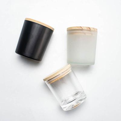 China Home Decoration Wholesale Mini Frosted Glass Small Candle Empty Jars with Wooden Lids Luxury Packaging Luxury Jars for Candle Making for sale