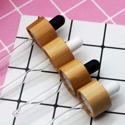 China 50csp cosmetic 18mm 410 20mm 410 glass bottle dropper cap wood grain bamboo lid with pipette for sale